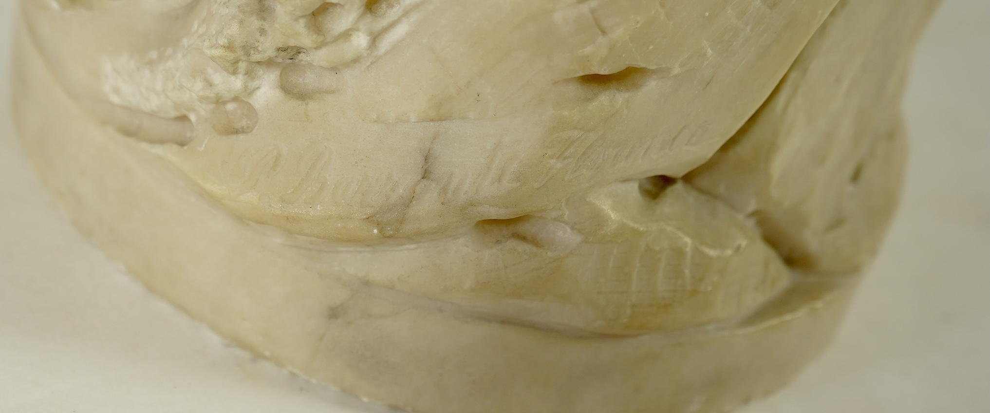 A Continental alabaster figure of a woman fishing, early 20th century